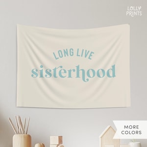 May include: A beige tapestry with the text "Long Live Sisterhood" in light blue lettering.