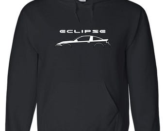 May include: Black hooded sweatshirt with a white graphic of a car and the word "ECLIPSE" above it. The sweatshirt has a front pocket and a drawstring hood. The graphic is a side profile of a car.