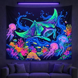 May include: Blacklight tapestry featuring a vibrant underwater scene. A large manta ray swims above colorful coral, jellyfish, and fish. The artwork uses bright neon colors of green, blue, pink, and orange, creating a glowing effect.