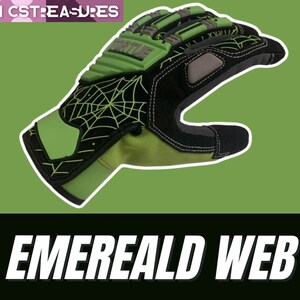 May include: Green and black work gloves with a spider web design and the word "FORTILE" printed on the back of the hand. The gloves have a textured palm and a reinforced thumb.