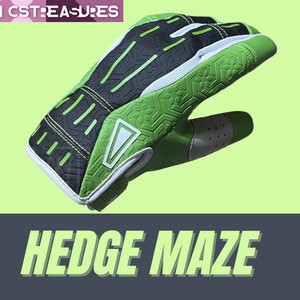 May include: Green and black patterned sports glove with a white logo and the text "HEDGE MAZE".