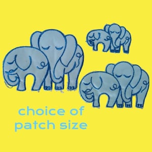 May include: Three different sizes of blue embroidered iron-on patches featuring a group of elephants. The text "choice of patch size" is below the patches.