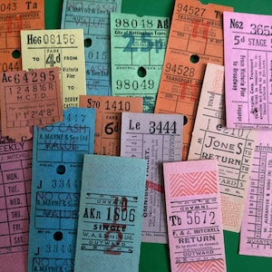 May include: A collection of vintage bus and train tickets from various cities and transportation companies. The tickets are in various colors, including pink, blue, green, orange, and yellow. Some of the tickets have text printed on them, such as "City of Nottingham Trans." and "Le 3444".