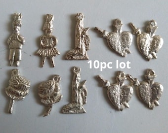 10pc Silvertone Milagros / boy/man, girl/woman, prayer figures, stabbed heart, roses