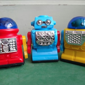 THREE (3) Little Friction Robots / 1990s reproduction toys / new old stock / B. Shackman