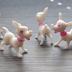 4pc Vintage Miniature White Dogs / playful cartoon-y puppies / plastic miniatures trinkets figures / Hong Kong / new old stock