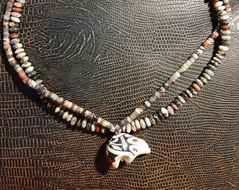 Two strands of silver leaf agate with a pottery bear pendant