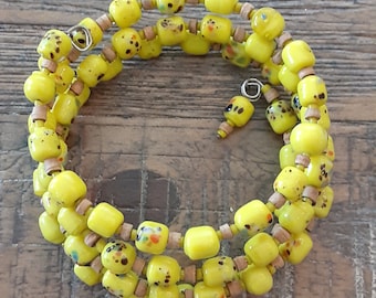 Yellow glass and wood bead bracelet on memory wire