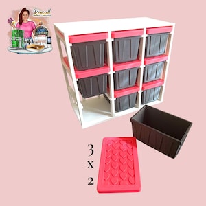 May include: A white storage unit with nine dark grey bins, each with a red lid. Two extra bins and a red lid with heart-shaped cutouts are also shown. The text "3 x 2" is visible.