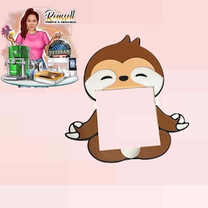 May include: A brown and white sloth-shaped memo holder with a light pink square in the centre. The sloth is in a seated, meditative pose. The background is light pink. The image also includes a cartoon of a woman with the text "Roussell Prints & Demands".