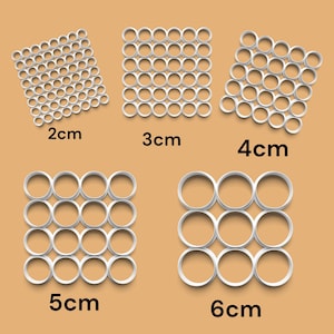 May include: White circle cutouts in a grid pattern, showing different sizes: 2 inches, 3 inches, 4 inches, 5 inches, and 6 inches.