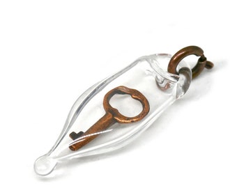 Blown Glass Capsule Charm with Miniature Antique Copper Key Inside