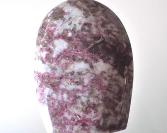 May include: A polished, rounded stone with a mix of colors. The stone features a base of white and gray, with veins of deep pink and burgundy running throughout. The shape is smooth and curved, with a flat base.