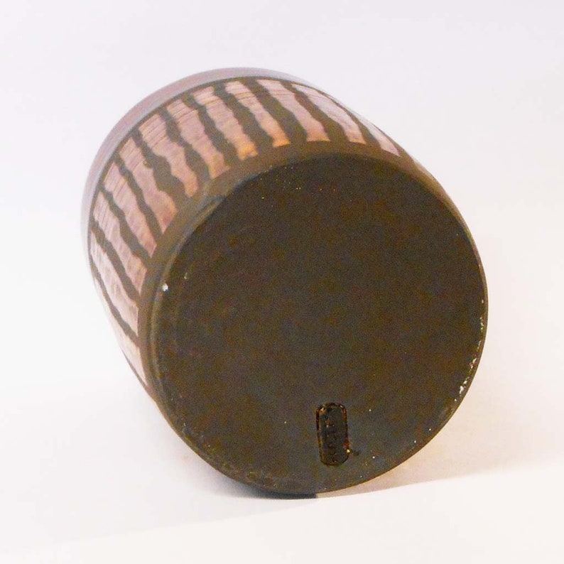 Wheel thrown black noir clay with Orange stripes.