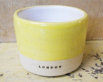 Tumbler/ Beaker Ceramic Yellow glazed stoneware London logo.