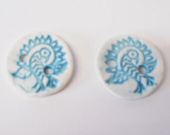 Button White Porcelain Ceramic  textured Blue Peacock design, glazed, two holes.