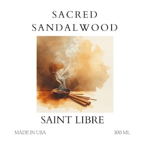 May include: A white label with the text "SACRED SANDALWOOD" and "SAINT LIBRE". The label features an illustration of a bowl with incense smoke rising, surrounded by incense sticks. The label also says "MADE IN USA" and "100 ML".