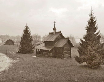 Wooden Chapel. Ancient Architecture. Onion Dome Church. Pine trees. Sepia. Novgorod, Russia.