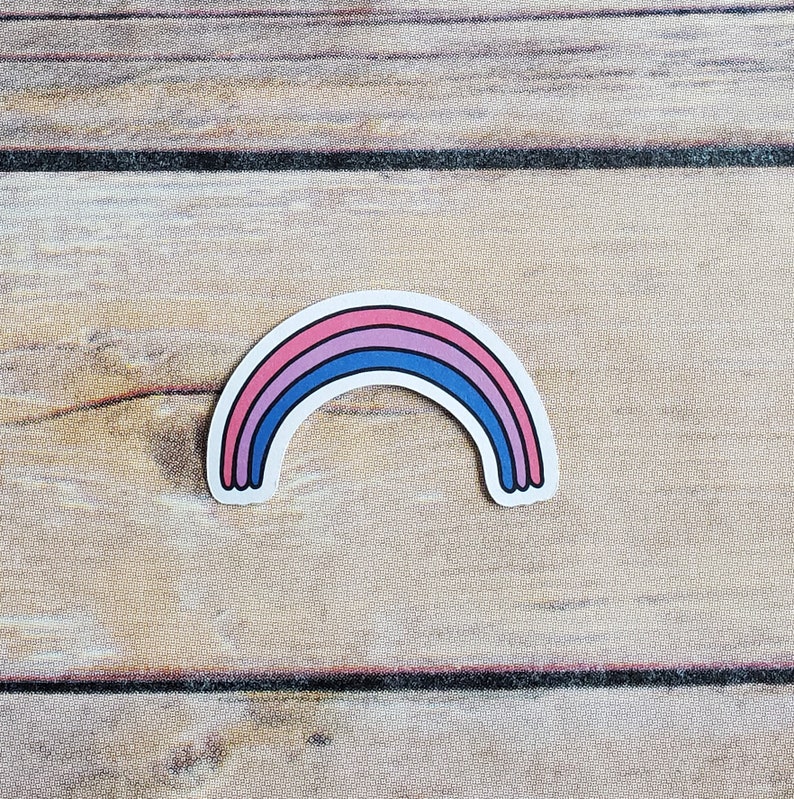 A cute sticker of a drawing of a rainbow with the colors of the bi pride flag. art by AnneArchy