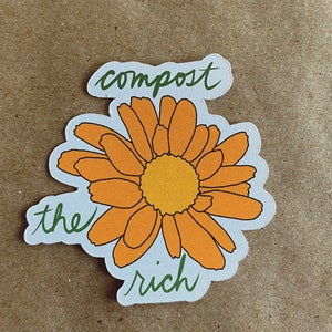 May include: A sticker with a yellow flower and the text "compost the rich" in green lettering.