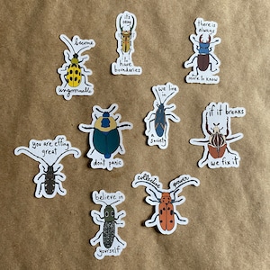 An assortment of stickers with original art and hand lettering by AnneArchy