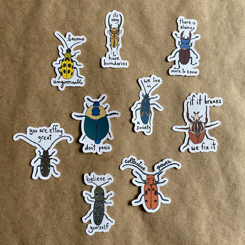 An assortment of stickers with original art and hand lettering by AnneArchy