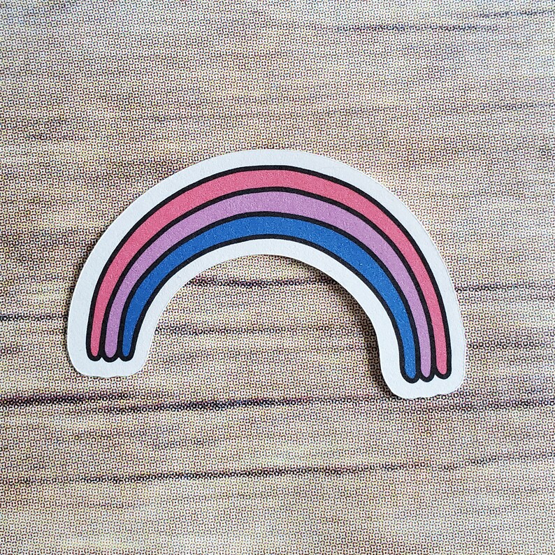 A cute sticker of a drawing of a rainbow with the colors of the bi pride flag. art by AnneArchy