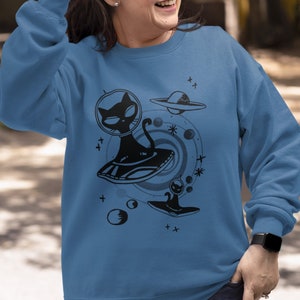 Alien Black Cat Crewneck Sweatshirt for Women | Astronomy Space Cat Sweater for Men | Kitty Sphynx Spaceship Sci-Fi Shirt