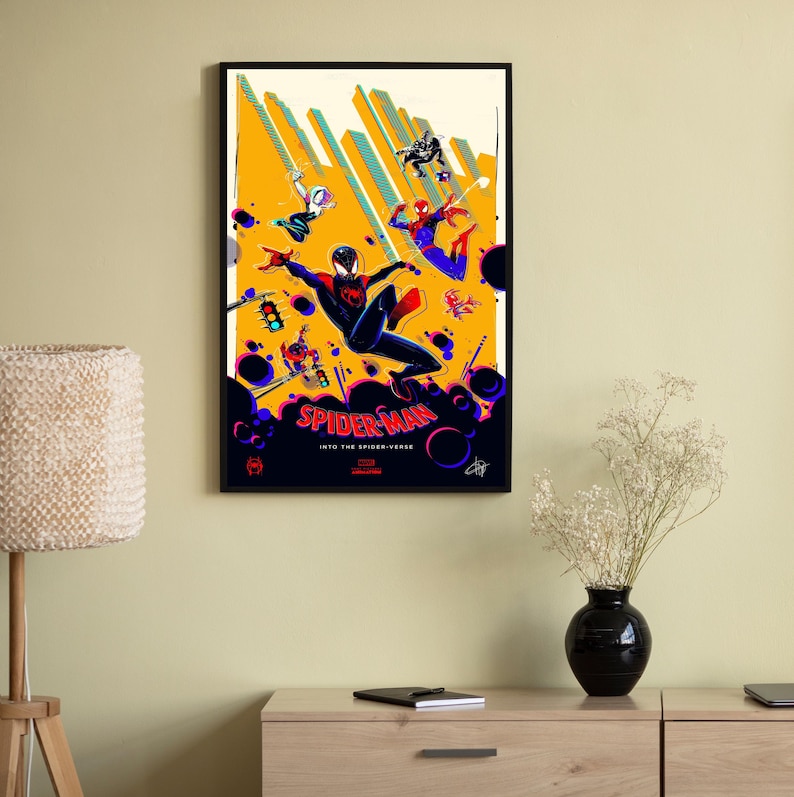 May include: A poster for the animated movie Spider-Man: Into the Spider-Verse. The poster features a yellow background with a black and red Spider-Man character in the center. Other Spider-Man characters are in the background. The text "Spider-Man: Into the Spider-Verse" is at the bottom of the poster.