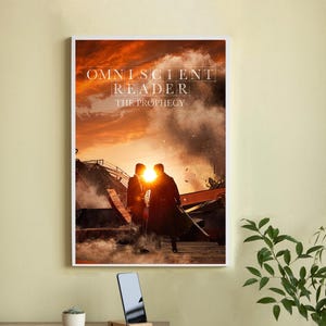 May include: A framed poster with the text "OMNISCIENT READER THE PROPHECY" against a fiery sunset backdrop. Two silhouetted figures stand in front of a bright light, with a scene of destruction in the background. A smartphone rests on a wooden stand.