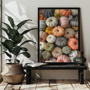 May include: A framed print featuring a close-up of a variety of pumpkins in shades of orange, green, gray, and white.