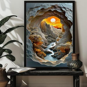 Peut inclure: Une impression d'art numérique d'un design de découpe de papier en couches représentant une scène de canyon avec une rivière qui la traverse. La scène est éclairée par un coucher de soleil orange vif avec un grand soleil rond dans le ciel. Les parois du canyon sont de couleur gris clair et la rivière est de couleur bleu clair. Les arbres sont de couleur vert foncé.