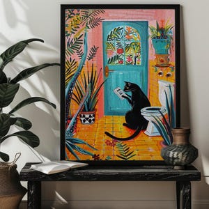 May include: A black cat sits on a toilet in a bathroom with a colorful tiled floor and a blue door with a floral design. The cat is reading a newspaper and there are plants in the room.