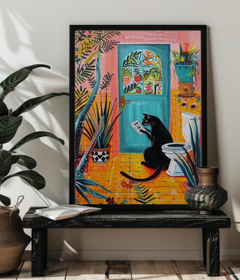 May include: A black cat sits on a toilet in a bathroom with a colorful tiled floor and a blue door with a floral design. The cat is reading a newspaper and there are plants in the room.