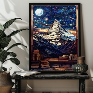 May include: A framed print of a mountain range with a full moon and stars in the night sky. The mountain range is surrounded by a stack of books.