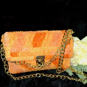 Handsewn hand crochet handmade and lined fluffy wool purse with fold chain handles
