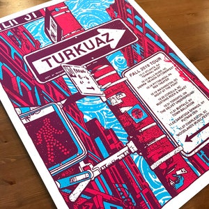 May include: A turquoise and red poster with a street scene and the text "TURKUAZ" and "FALL 2019 TOUR". The poster lists tour dates and locations for the band Turkuaz.