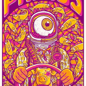 May include: A vibrant concert poster for Primus, featuring a surreal astronaut with a giant eye, surrounded by yellow fish. The astronaut is driving a vehicle with a pig-shaped steering wheel. The poster has a pink and yellow color scheme.