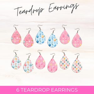 May include: Six pairs of teardrop-shaped earrings with a pastel pink and blue Easter egg pattern. The earrings are displayed on a light wood background. Teardrop Earrings.