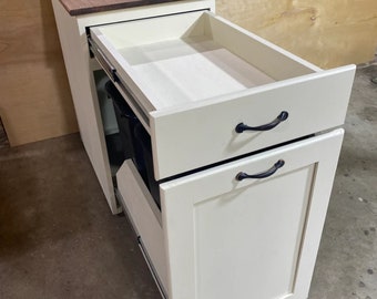 Cabinet with two pull-out garbage cans