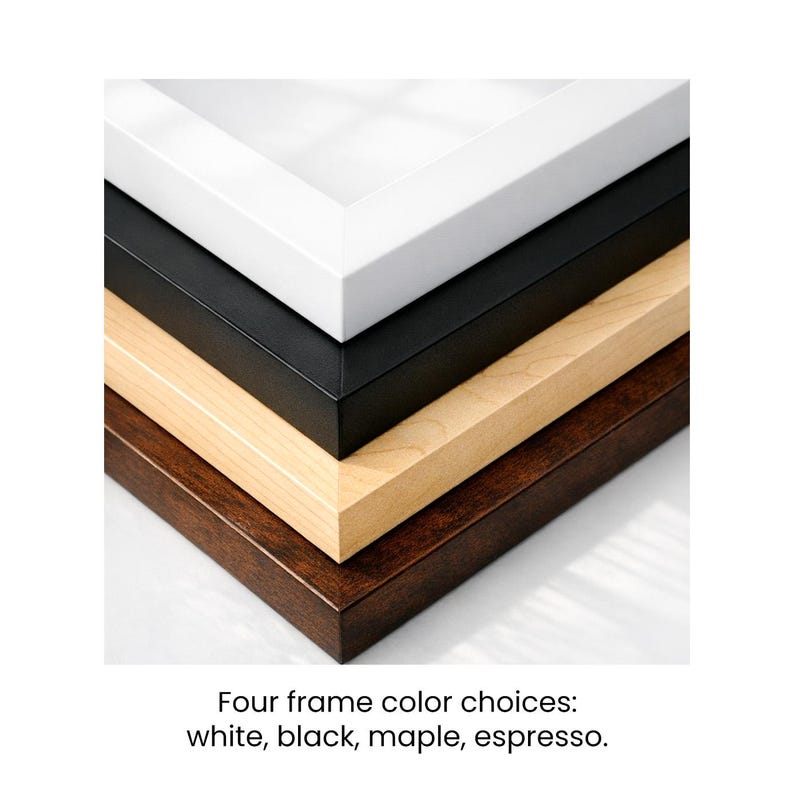 May include: A stack of four picture frames in different colors: white, black, maple, and espresso. The frames are stacked diagonally, showcasing the color options. The text at the bottom reads: Four frame color choices: white, black, maple, espresso.