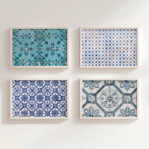 May include: Four framed wall art pieces featuring intricate tile designs. The tiles showcase patterns in shades of blue and teal, with floral and geometric motifs. Each framed piece has a white border.