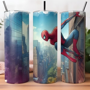 May include: Three stainless steel tumblers with a Spiderman design. The tumblers feature a cityscape background with Spiderman swinging through the city. One tumbler has a purple and blue cityscape, one has a blue cityscape, and one has a cityscape with Spiderman swinging from a building.