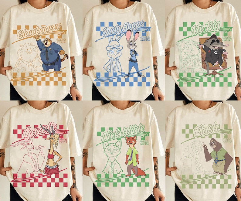 May include: A collection of six off-white t-shirts featuring Zootopia character graphics. Each shirt displays a character name, a year, a checkered border, and a colored illustration of Clawhauser, Judy Hopps, Mr. Big, Gazelle, Nick Wilde, or Flash.