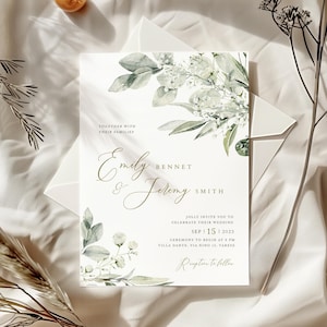 May include: Wedding invitation with a watercolor floral design in shades of green and white. The invitation features the names "Emily Bennet & Jeremy Smith" and the wedding date "Sep 15, 2023".