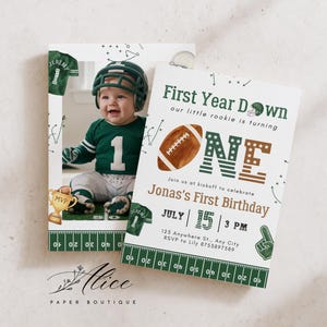 May include: A football-themed first birthday invitation card featuring a photo of a baby in a green jersey and helmet, with text reading First Year Down, our little rookie is turning ONE, Jonas's First Birthday, July 15, 3 PM, and address details.