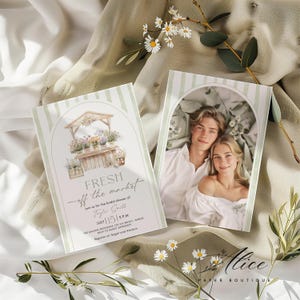 May include: Two invitation cards with a watercolor design. One card features a couple, the other has a floral market illustration with the text "FRESH off the market". The cards are for a bridal shower.