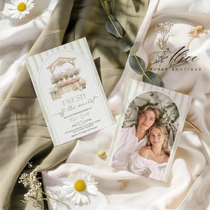 May include: Two invitation cards with a floral market design and a photo of a couple. The cards have a green and white striped border. The text on the card reads "FRESH off the market" and "Alice Paper Boutique".