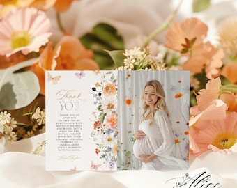 May include: A baby shower thank you card with a floral design and a photo of a pregnant person. The card features the text "Thank You" and a message of gratitude. The background includes peach-colored flowers and butterflies.