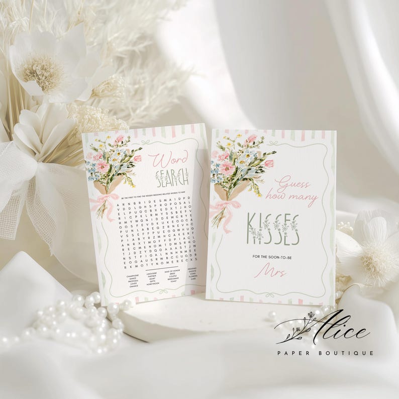 May include: Two bridal shower game cards. One card says "Word Search" and the other says "Guess how many kisses". Both cards have a floral bouquet illustration with pink ribbons. The Alice Paper Boutique logo is in the bottom right.